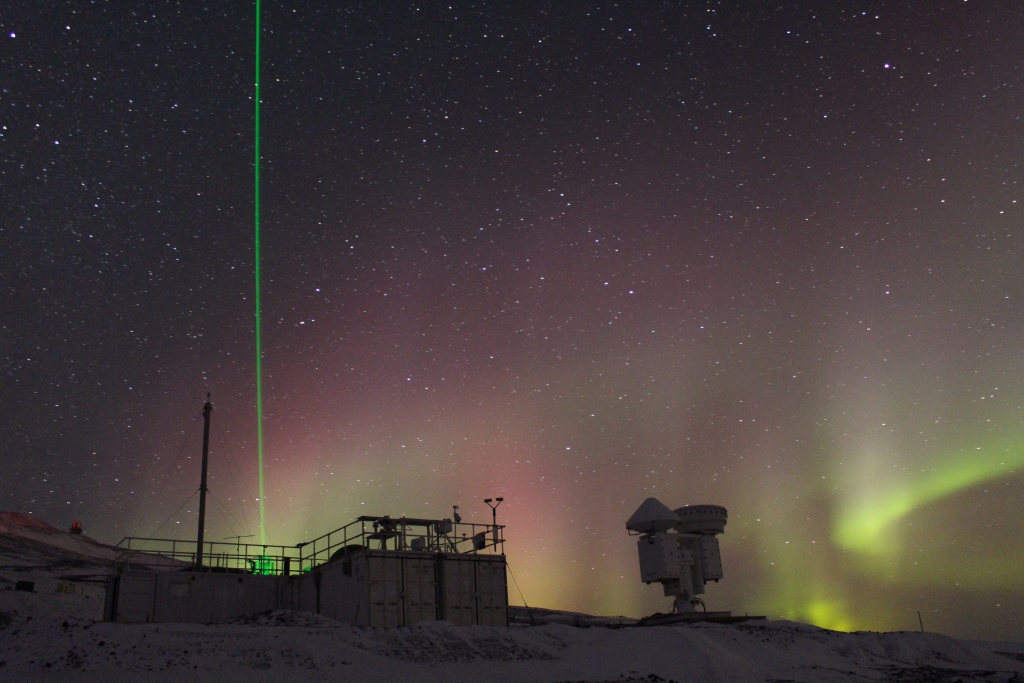 Photo of Aurora at the CosRay site near McMurdo Sound. The laser beam that appears is from the High Spectral Resolution Lidar (HSRL), which gives us information about cloud and aerosol layer microphysics - 03 August 2016